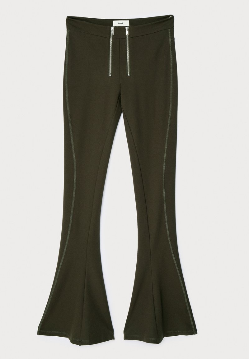 Dark olive green flared pants made of stretchy material, featuring metallic zipper details and contrasting side seams.