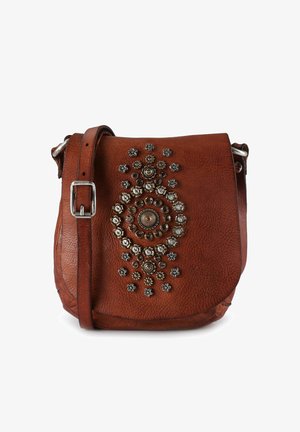 Brown leather crossbody bag with decorative metallic studs and circular pattern accents on the front. Adjustable strap and flap closure.