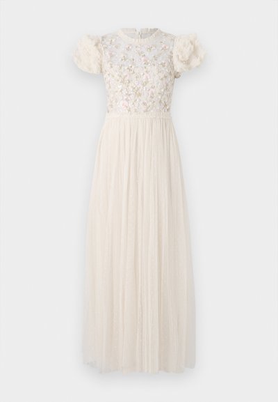 Long cream dress with a floral embroidered bodice, short puff sleeves, and a pleated sheer skirt adorned with small polka dots.