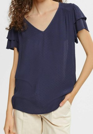 Marineblaue V-Ausschnitt-Bluse aus strukturiertem Stoff mit kurzen, gerafften Ärmeln und lockerem Schnitt. Glatte Oberfläche mit dezenten Designdetails.