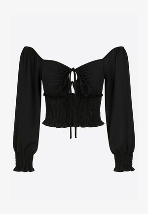 Top corto negro con mangas descubiertas, cuerpo fruncido y detalle de lazo en el frente. Hecho de una tela suave con un acabado texturizado.