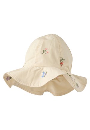 Kremfarget solhatt med bred brem og små broderte blomster i forskjellige farger spredt på stoffet.