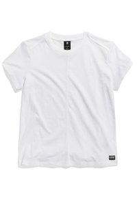 T-shirt blanc à manches courtes en coton avec un col rond, présentant un logo discret sur la poitrine et une étiquette rectangulaire à l'ourlet.