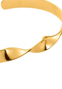 Gulltone vridd hårbånd med en jevn, skinnende overflate og en bølgete design. Lett metallkonstruksjon med polert finish.