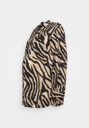 Camisa de manga longa com padrão de riscas de tigre nas cores bege e preto. Feita de um tecido leve, com um corte descontraído e colarinho.