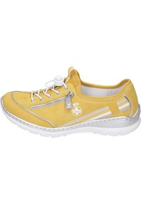 Yellow suede sneaker with a round toe, white lace-up closure, side zip, silver accents, and textured white sole. Soft lining interior.