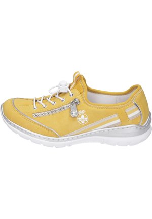 Yellow suede sneaker with a round toe, white lace-up closure, side zip, silver accents, and textured white sole. Soft lining interior.