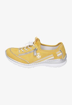 Yellow suede sneaker with a round toe, white lace-up closure, side zip, silver accents, and textured white sole. Soft lining interior.