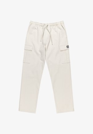 Světle béžové cargo kalhoty vyrobené z bavlny s elastickým pasem, šňůrkou a dvěma velkými bočními kapsami. Na přední straně je logo nášivka.