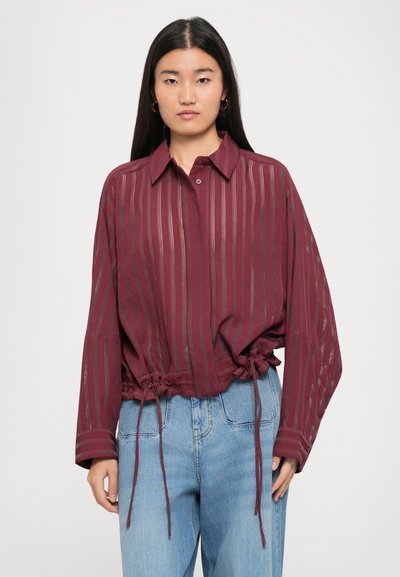 Maroon striped blouse with a collared neckline, long sleeves, and adjustable drawstring at the waist. Lightweight fabric with a sheer texture.