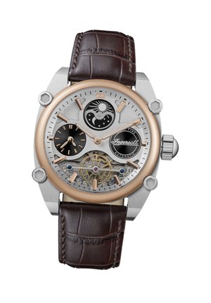 Montre automatique avec un boîtier en argent et or rose, un bracelet en cuir de crocodile marron, un cadran complexe avec des motifs de soleil et de lune, et un mouvement exposé.