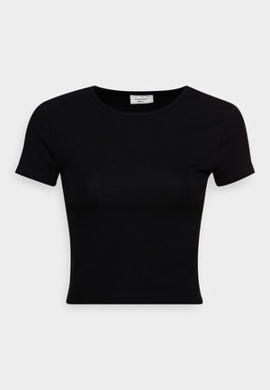 Svart t-skjorte med korte ermer laget av glatt bomullsstoff, med rund hals og en figursydd design. Minimalistisk uten synlige mønstre.