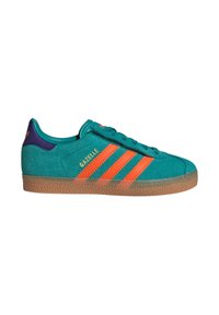 Teal suede sneaker with orange stripes and "Gazelle" branding, featuring a textured gum outsole and a purple accent on the heel.