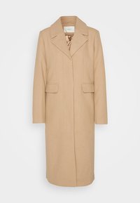 Beige ullfrakk med krage, frontlås, to frontlommer og en glatt tekstur. Har foret innside.