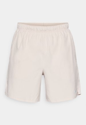 Lichte beige sportshorts met een elastische tailleband, gladde stof, zijpanelen van gaas en een subtiel logo op het rechteronderbeen.