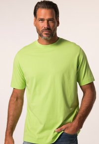 Svěží zelené tričko s krátkým rukávem vyrobené z měkké tkaniny, s klasickým designem kulatého výstřihu a volným střihem.