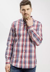 Koszula z kołnierzykiem w czerwoną, niebieską i białą kratę, z długimi rękawami i zapięciem na guziki. Wykonana z tkaniny tkanej.