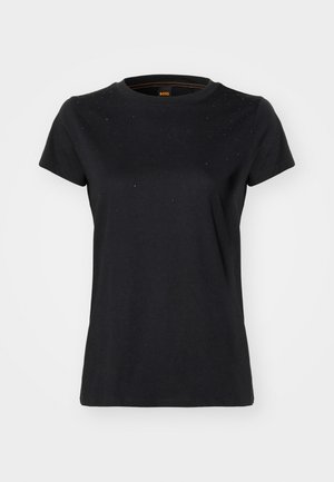 Black cotton T-shirt with short sleeves, round neck, and subtle embellishments on the chest. Smooth texture and relaxed fit.