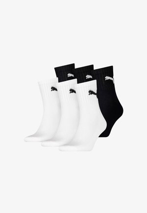 Four pairs of crew socks: two white with black logos and two black with white logos. Ribbed tops; smooth texture; athletic style.