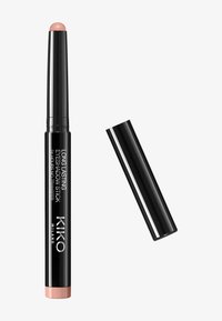 Long-lasting eyeshadow stick with a black cylindrical body and a rose gold base; smooth, creamy texture; capped top reveals a light nude shade.