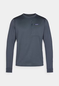 Long-sleeve, navy blue synthetic shirt with a round collar, chest pocket, and a half-zip closure. Smooth texture and fitted design.