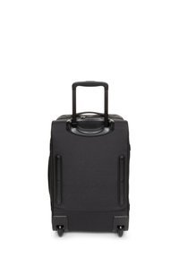 Black suitcase with a textured fabric exterior, retractable handle, and four wheels for mobility. Features smooth edges and durable hardware.