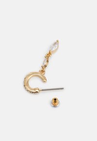 Gold-tone earring featuring a curved design, with a clear marquise-cut stone above a pin and a securing back.