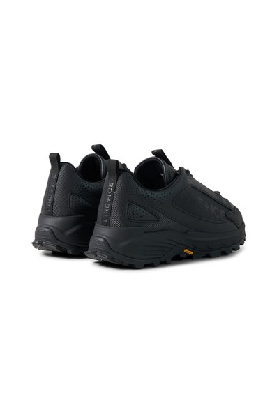Pair of black rugged sneakers with thick soles, pull tabs on heels, perforated details, and "ICE+ICE" branding on the sides.