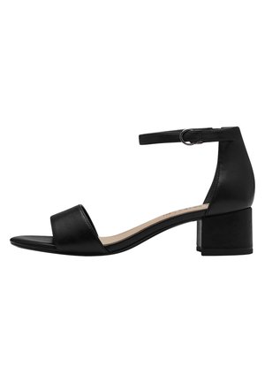 Black leather heeled sandals with an open toe, adjustable ankle strap, and a block heel. Smooth texture with a minimalist design.