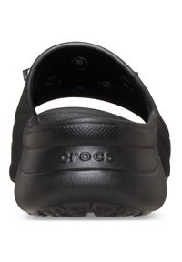 Zuecos negros Crocs con tira trasera, presentan un acabado suave y mate, una forma contorneada y una suela texturizada para mayor adherencia y comodidad.