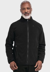 Schwarze Fleece-Jacke mit hohem Kragen, Reißverschluss auf der Vorderseite und Seitentaschen. Verfügt über eine glatte Textur und dezentes Logo-Detail auf der Brust.