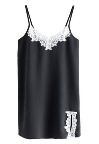 Camisole nera in tessuto strutturato, con rifinitura in pizzo bianco lungo lo scollo e un dettaglio decorativo in pizzo sull'orlo.