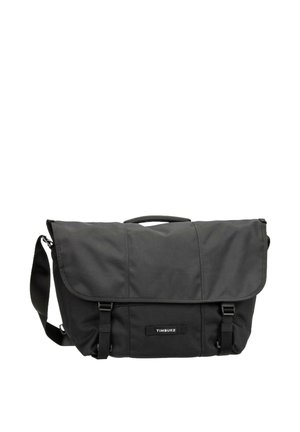 Bolsa de mensajero de nylon negra con cierre de solapa, dos correas con hebilla, correa de hombro ajustable y parche con el logo "TIMBUK2" en el centro delantero.