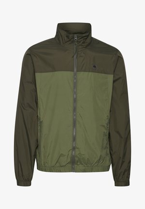 Olive green lightweight jacket with a zip front, high collar, elastic cuffs, and a two-tone design featuring darker and lighter green panels.