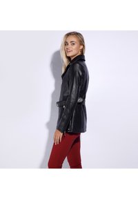 Black leather jacket with a fitted silhouette, featuring a lapel collar, zippered front, side pockets, and a belted waist detail.