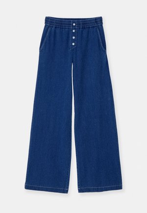 Bredde denimbukser i mørkeblå med elastisk midje, fem knapper foran og sidelommer. Glatt tekstur og rene sømmer.