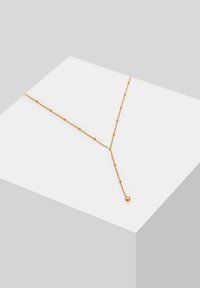 Collier doré avec un design en forme de Y. Présente une chaîne avec de petites perles et un pendentif sphérique à l'extrémité, soulignant une élégance linéaire.
