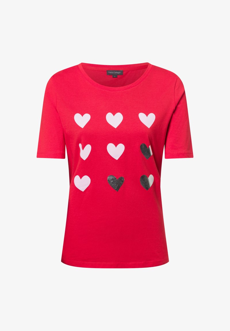 Red short-sleeve T-shirt featuring a pattern of white and black hearts in various sizes, made from soft cotton material. Round neck design.