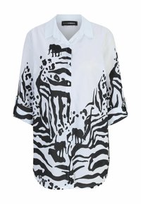 White button-up shirt featuring a black animal print design with elephants. Short sleeves with rolled cuffs, relaxed fit, cotton material.