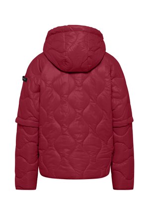 Red quilted jacket with a hood, featuring rounded shapes in the fabric texture, long sleeves, and a logo accent on the left sleeve.