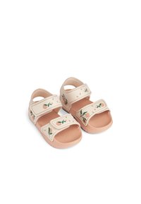 Ljusbeige barnsandaler med rosa detaljer, dubbla kardborreband, blomstertryck och texturerade sulor för grepp.