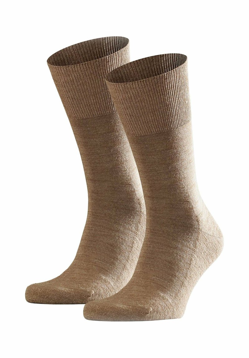Calzini marroni con polsino a coste, realizzati in un materiale morbido e testurizzato. Presentano un corpo liscio e una punta e un tallone leggermente più chiari.