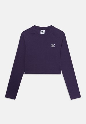 Sweatshirt court à manches longues de couleur pourpre, fabriqué en tissu texturé, arborant un logo Adidas blanc sur la poitrine et un col rond.