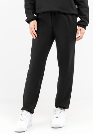BACK LOGO - Tracksuit bottoms - black