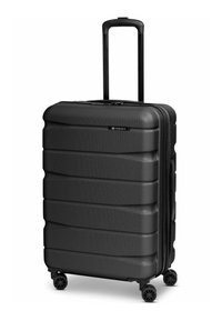 Valise rigide noire à surface texturée, quatre roues pivotantes, poignées latérales et supérieures, et poignée télescopique extensible.