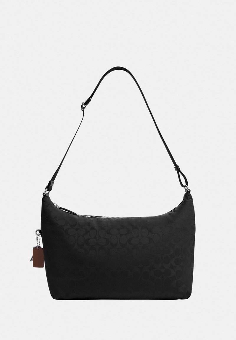 Black shoulder bag with subtle monogram pattern, adjustable strap, top zipper, and a small leather tag attached to the side.
