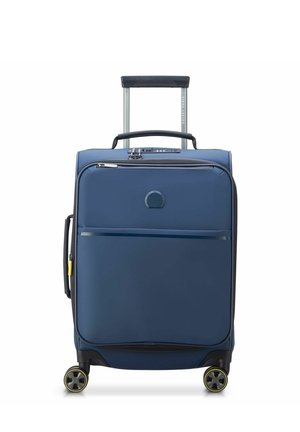 Blue hard-shell suitcase with a retractable handle, four multi-directional wheels, and zippered compartments. Smooth texture and minimal design.