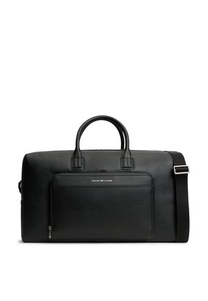 Μαύρη δερμάτινη τσάντα duffel με διπλές λαβές, μπροστινή τσέπη με φερμουάρ, ρυθμιζόμενο ιμάντα ώμου και μικρό λογότυπο Tommy Hilfiger στην μπροστινή τσέπη.