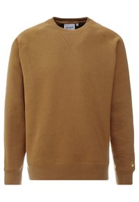 Brun crewneck-tröja gjord av bomullsblandat tyg. Har ribbstickade muddar och fåll samt sydda detaljer längs halslinningen.