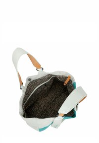 Borsa con esterno bianco e dettagli turchesi, manici in pelle e interno marrone a fantasia con una tasca con zip e chiusure a scatto.